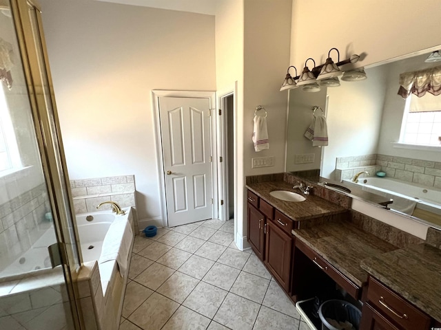 bathroom with tile patterned floors, vanity, and shower with separate bathtub