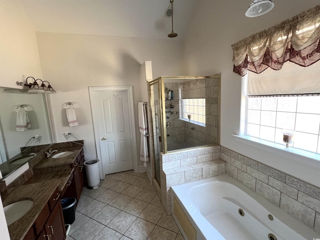 bathroom featuring vanity, tile patterned floors, and shower with separate bathtub