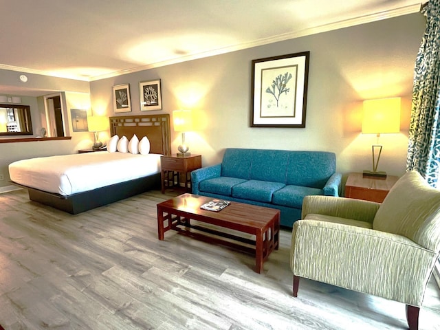 bedroom with hardwood / wood-style flooring and ornamental molding