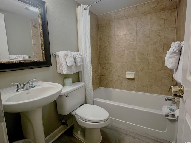 full bathroom with toilet, sink, shower / tub combo with curtain, and hardwood / wood-style floors