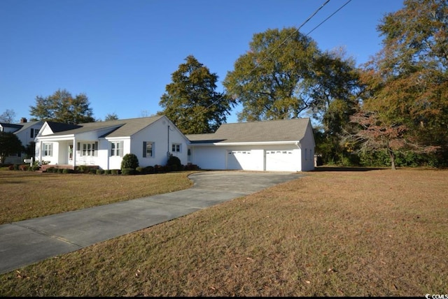 ranch-style house with a garage and a front lawn