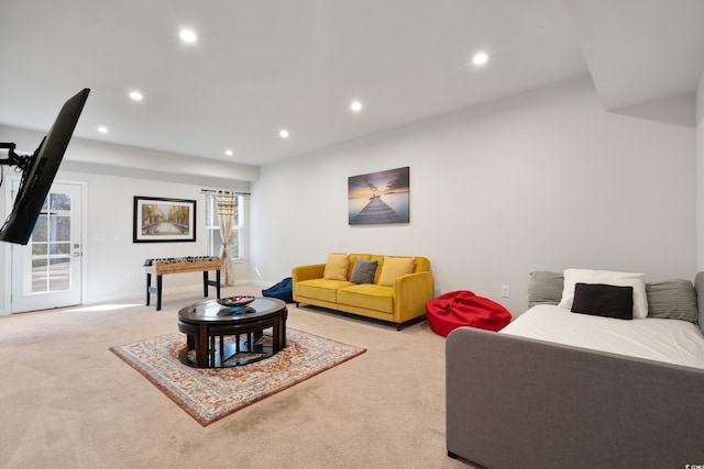 living room with light carpet, baseboards, and recessed lighting