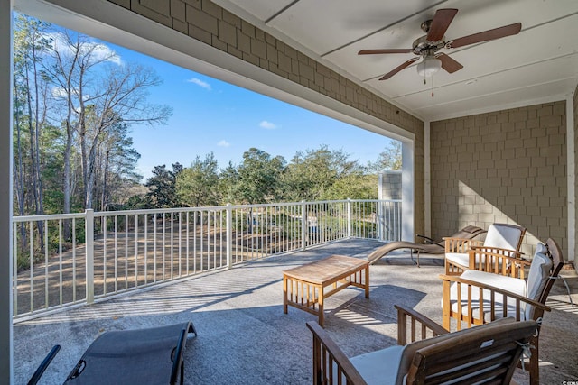 view of patio / terrace featuring a balcony and ceiling fan