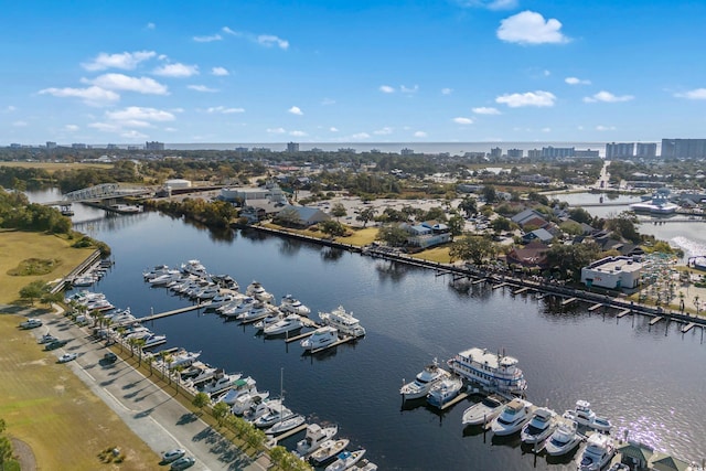 birds eye view of property featuring a view of city and a water view