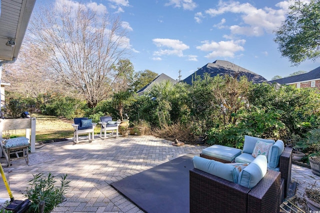 view of patio featuring an outdoor living space and a mountain view