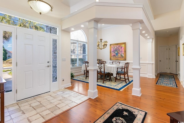 entrance foyer featuring light wood-type flooring and a chandelier