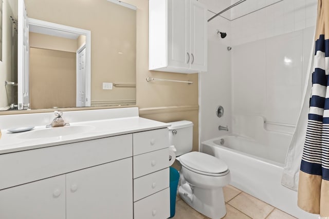 bathroom featuring toilet, shower / bath combo, vanity, and tile patterned floors