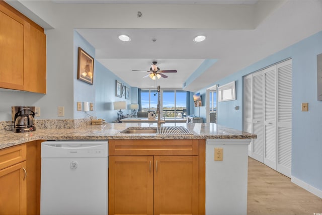 2100 Sea Mountain Hwy Unit 630, North Myrtle Beach, SC 29582 - kitchen featuring white dishwasher, ceiling fan, light stone counters, and a peninsula
