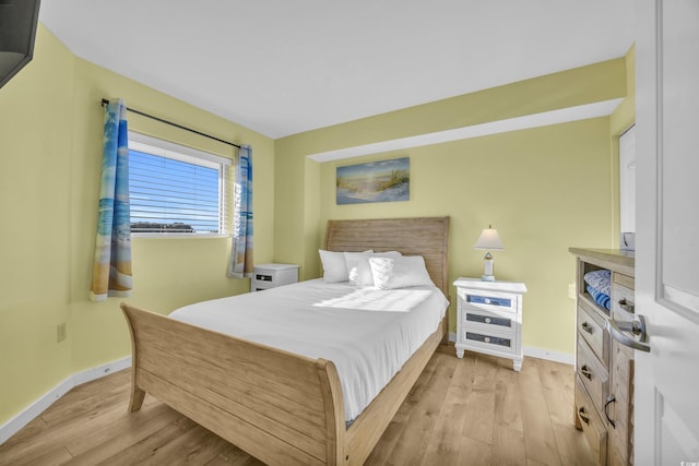 bedroom with light hardwood / wood-style floors