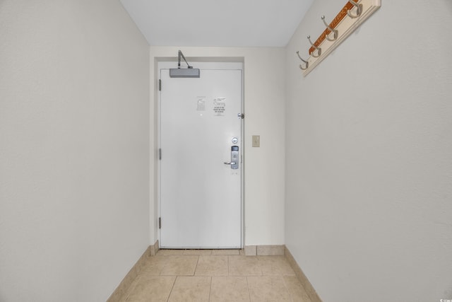 doorway to outside featuring light tile patterned floors