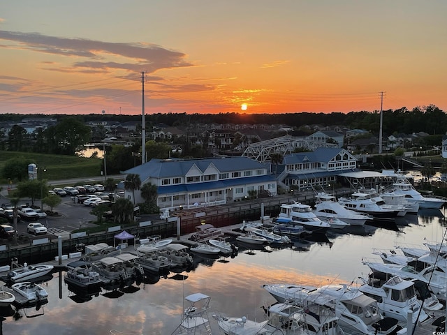 aerial view at dusk with a water view