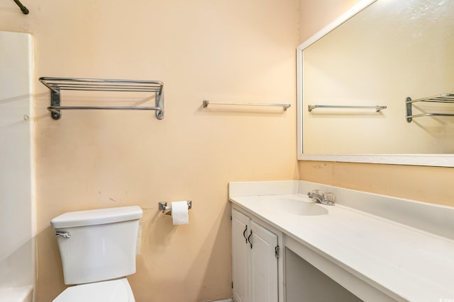 bathroom with toilet and vanity