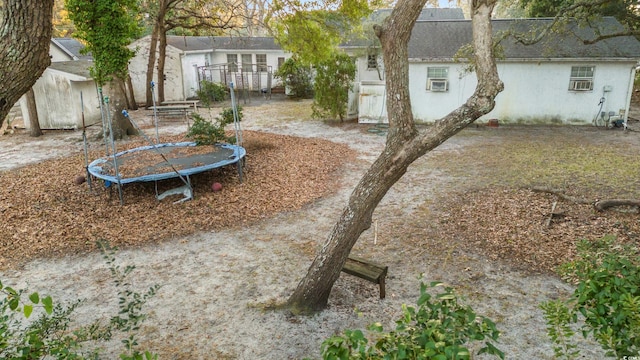 view of yard featuring a trampoline