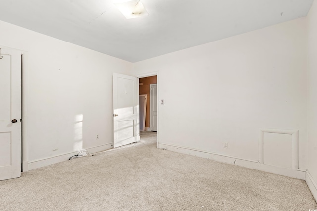 spare room with light colored carpet