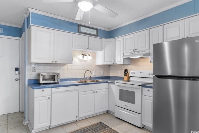 kitchen featuring white appliances, a textured ceiling, white cabinetry, sink, and ornamental molding