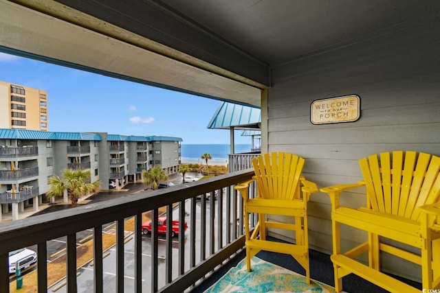 balcony featuring a water view