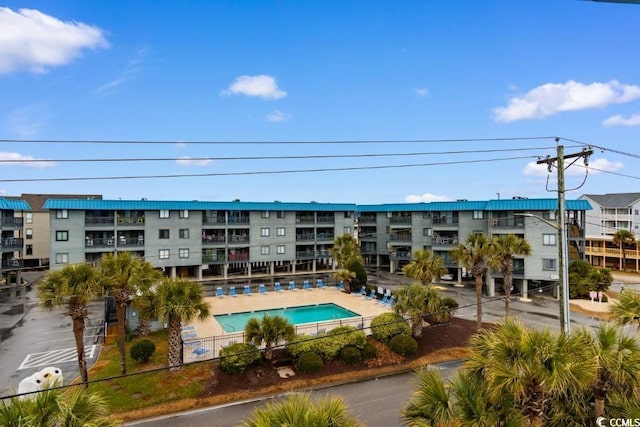 view of property featuring a community pool