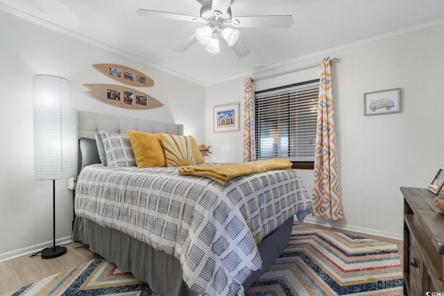 bedroom featuring ceiling fan, wood-type flooring, crown molding, and a textured ceiling