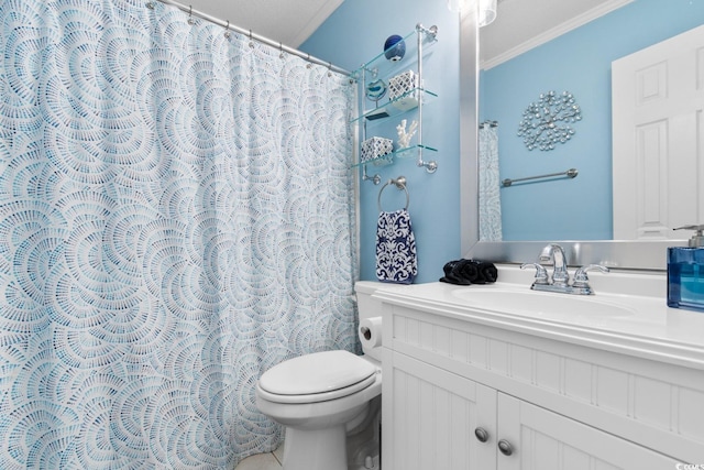 bathroom featuring toilet, vanity, and crown molding