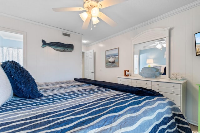 bedroom with ceiling fan and ornamental molding