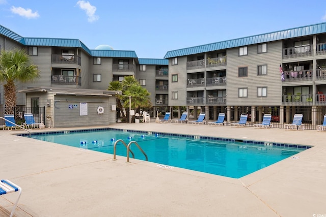 view of pool featuring a patio area