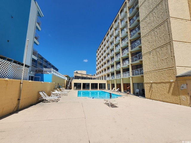 view of pool featuring a patio