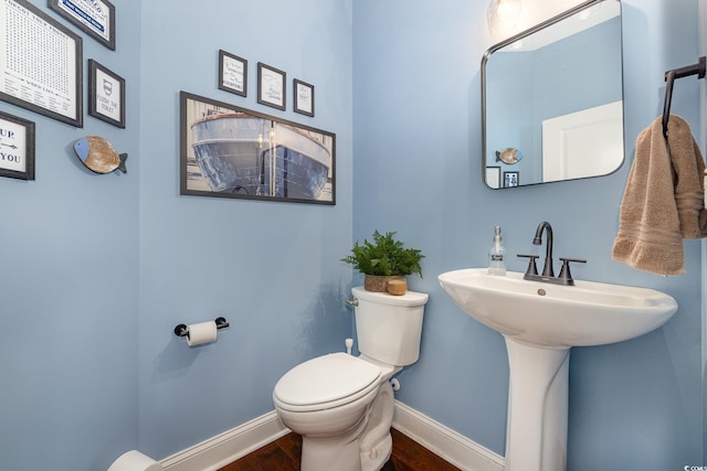 bathroom featuring toilet and hardwood / wood-style floors