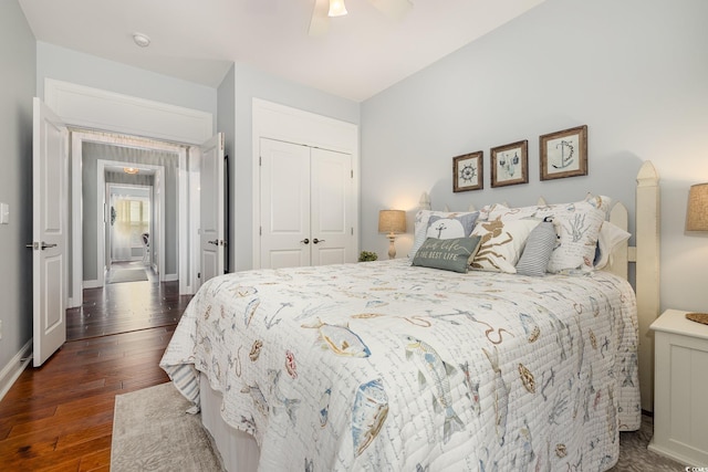 bedroom with ceiling fan, dark hardwood / wood-style floors, and a closet