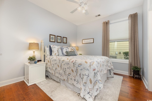 bedroom with ceiling fan and dark hardwood / wood-style floors