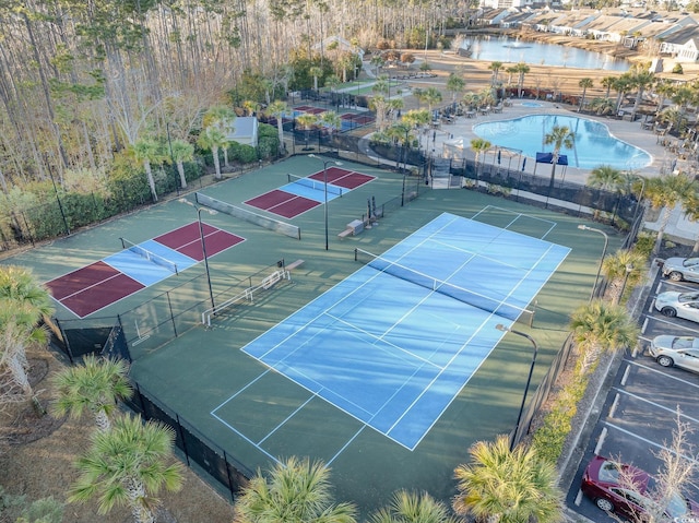 birds eye view of property with a water view