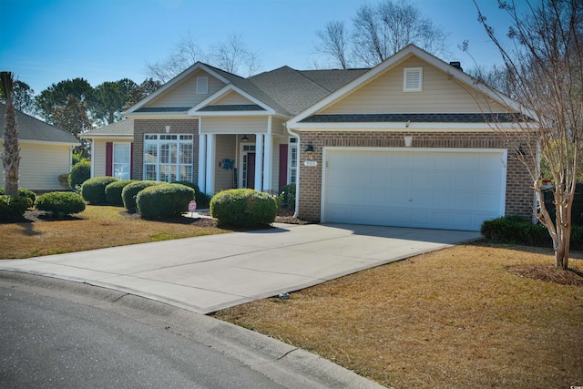 single story home featuring a garage and a front lawn