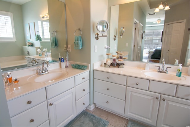 bathroom featuring tile patterned flooring, vanity, and ceiling fan