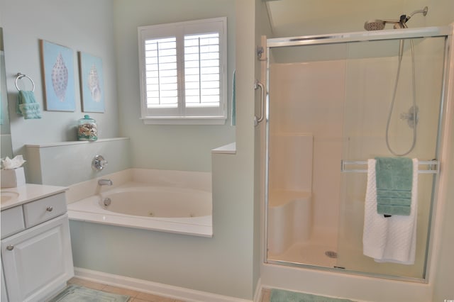 bathroom featuring vanity, tile patterned flooring, and independent shower and bath