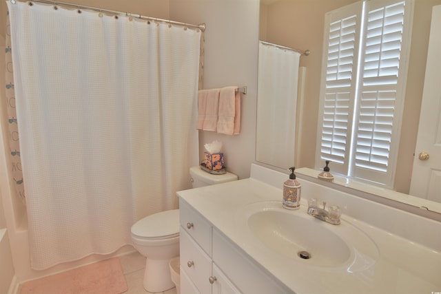 bathroom featuring vanity, tile patterned floors, and toilet