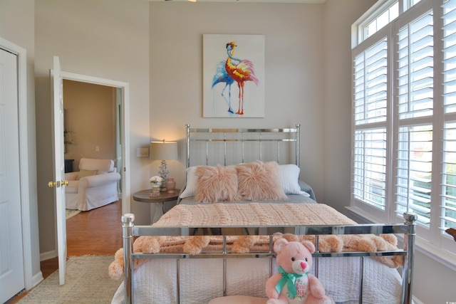 bedroom with wood-type flooring