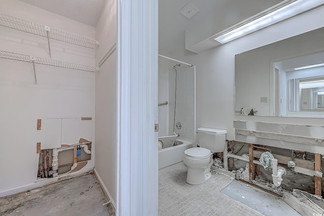 bathroom featuring shower / washtub combination and toilet