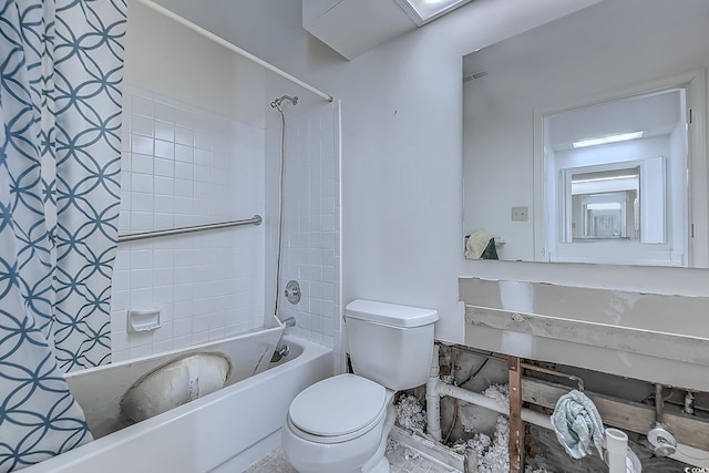 bathroom featuring toilet and tiled shower / bath combo