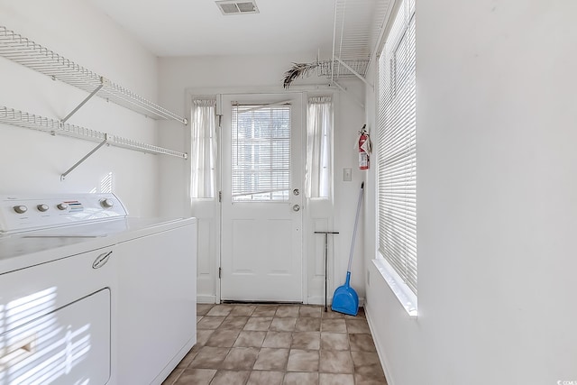 washroom featuring washing machine and dryer