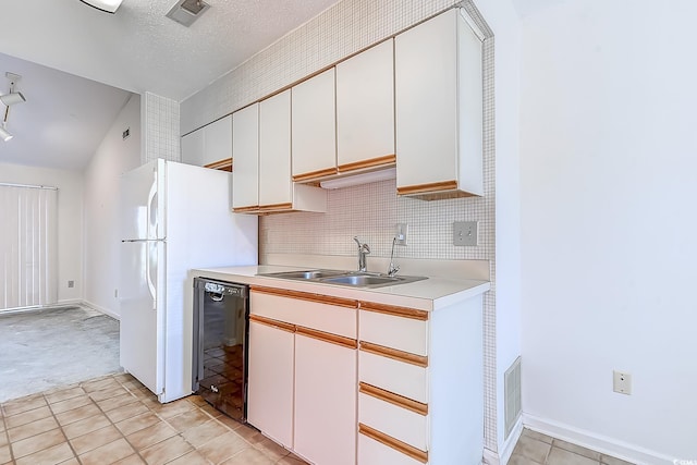 kitchen with a textured ceiling, white cabinets, dishwasher, tasteful backsplash, and sink