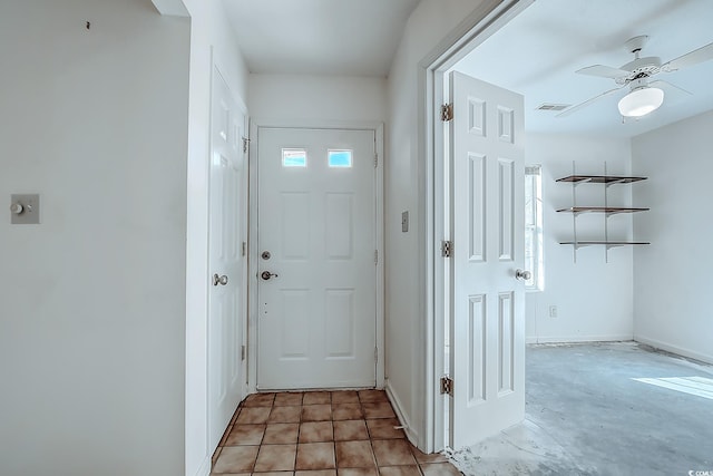 doorway with ceiling fan