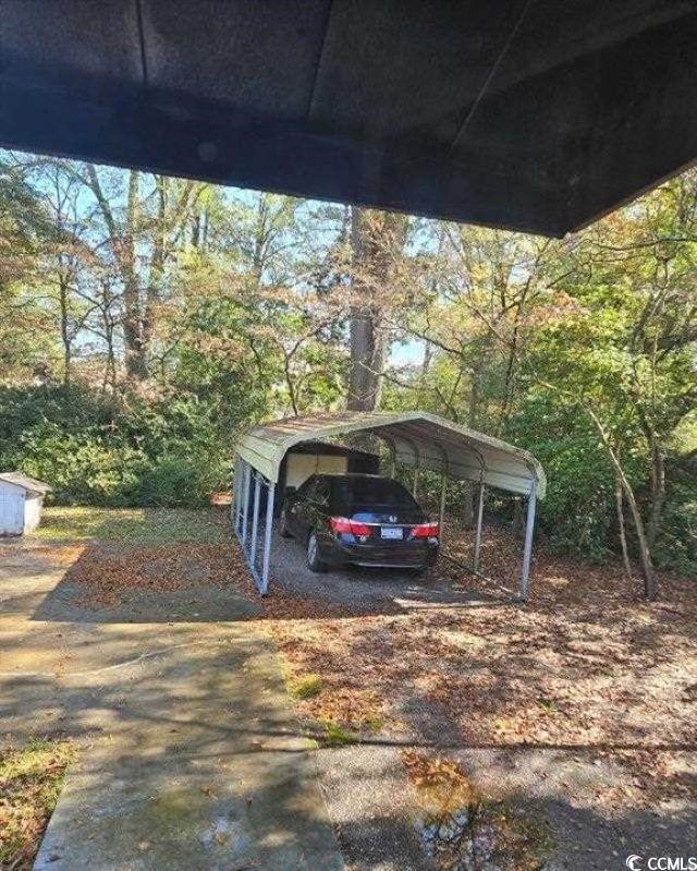 view of parking featuring a detached carport