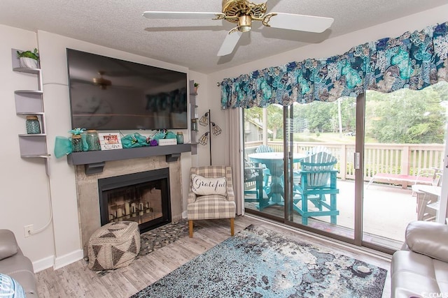 living room with hardwood / wood-style floors and a textured ceiling