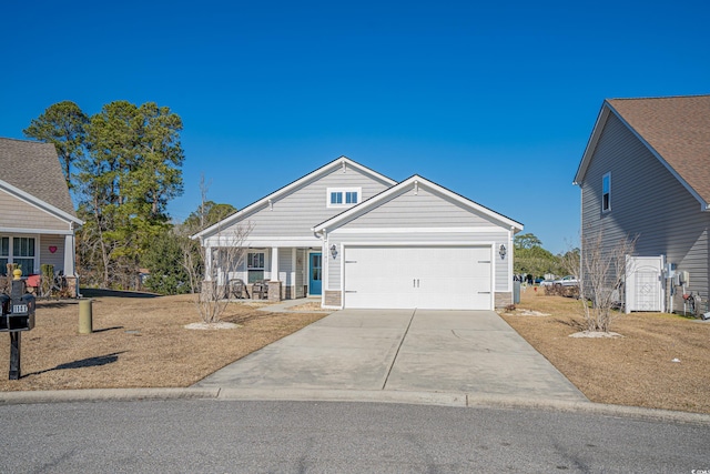 view of front facade featuring covered porch and a garage