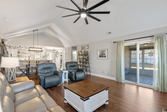 living room featuring vaulted ceiling, dark wood-type flooring, and ceiling fan