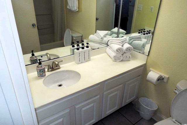 full bathroom featuring toilet, tile patterned flooring, and vanity