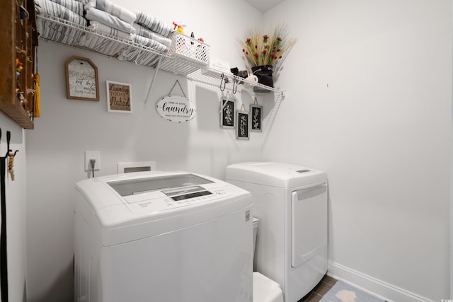 washroom featuring washing machine and dryer