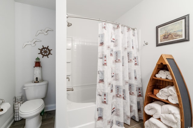 bathroom with toilet and shower / bath combo with shower curtain