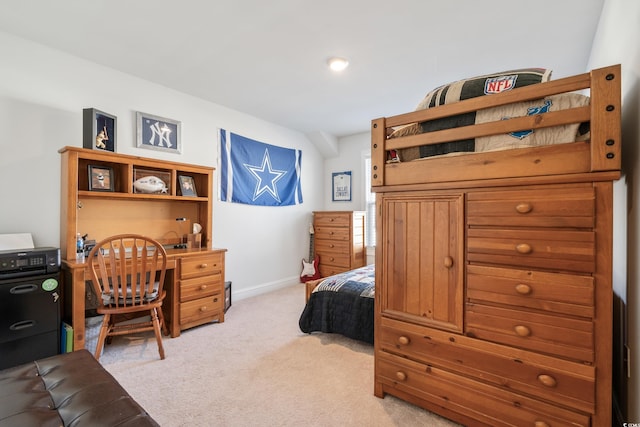 bedroom featuring light colored carpet