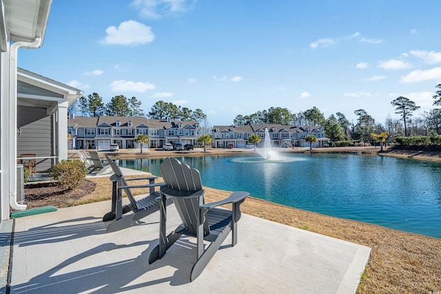 view of pool featuring a water view