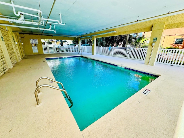 view of pool featuring a patio area